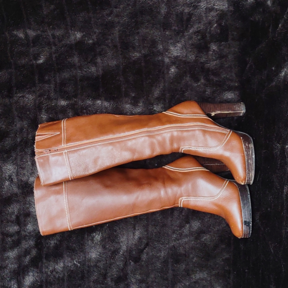 Women's knee high, 4" heel, zip leather boots. Size 5
